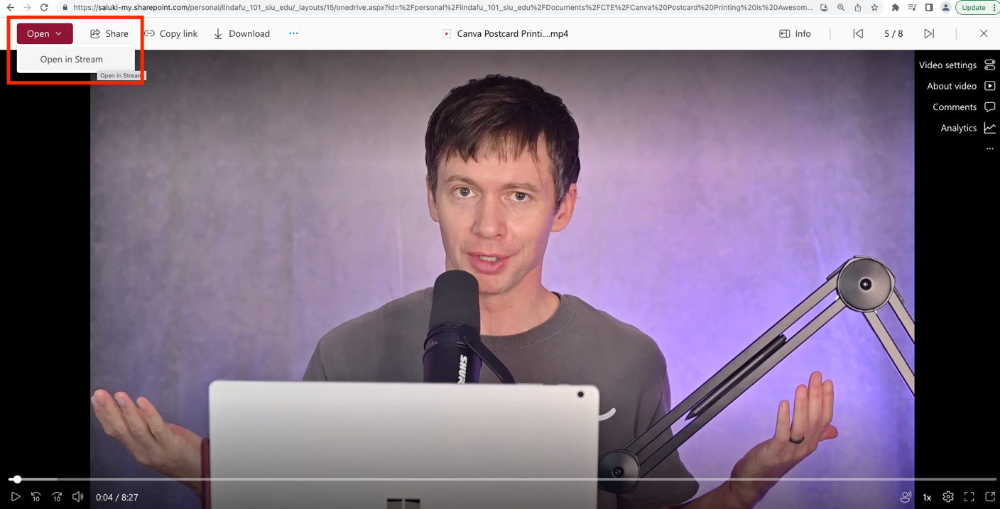A screenshot a video streaming on OneDrive, highlighting Open and Open in Stream in the upper left corner